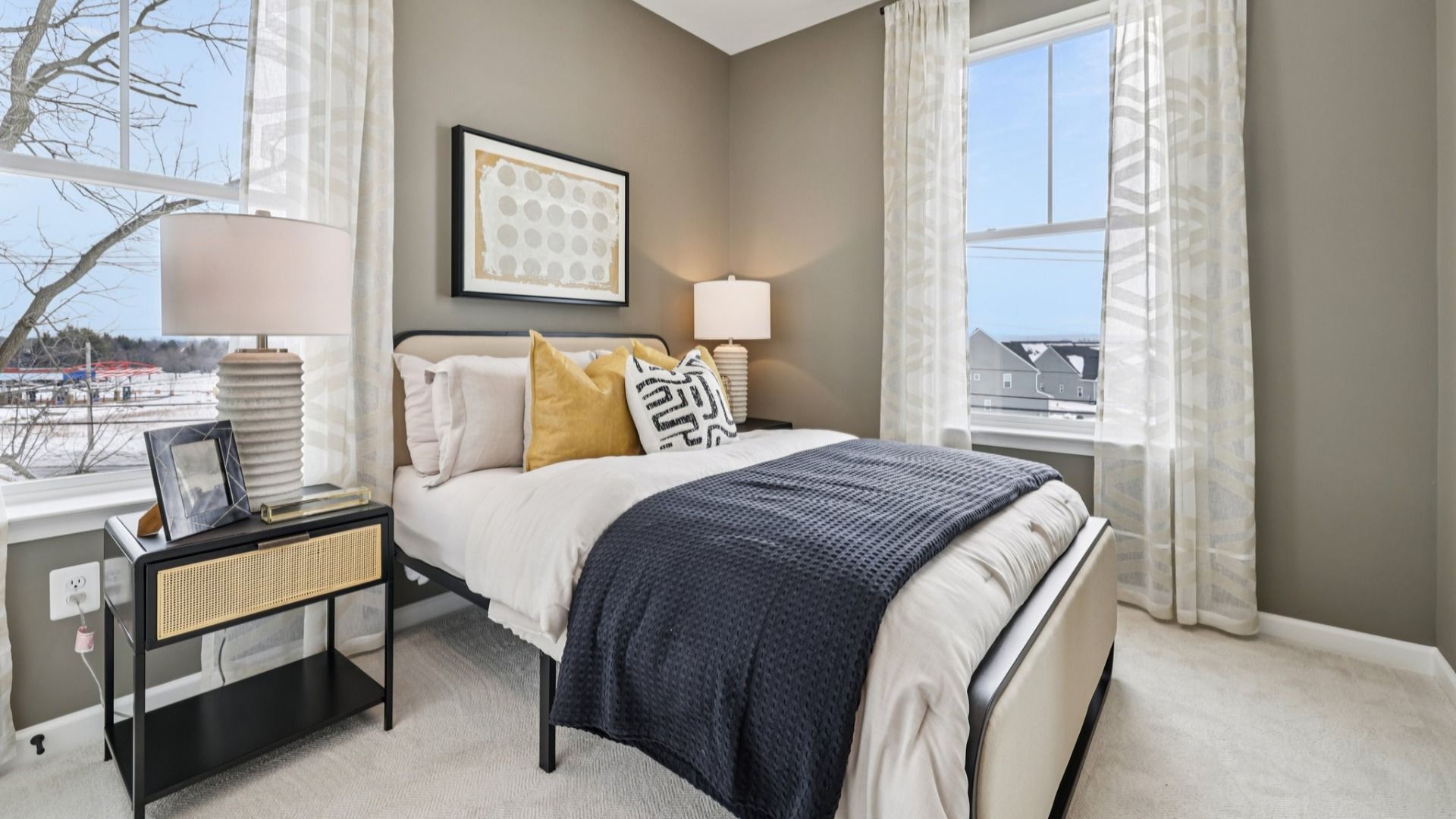 Windows let natural light into the third bedroom