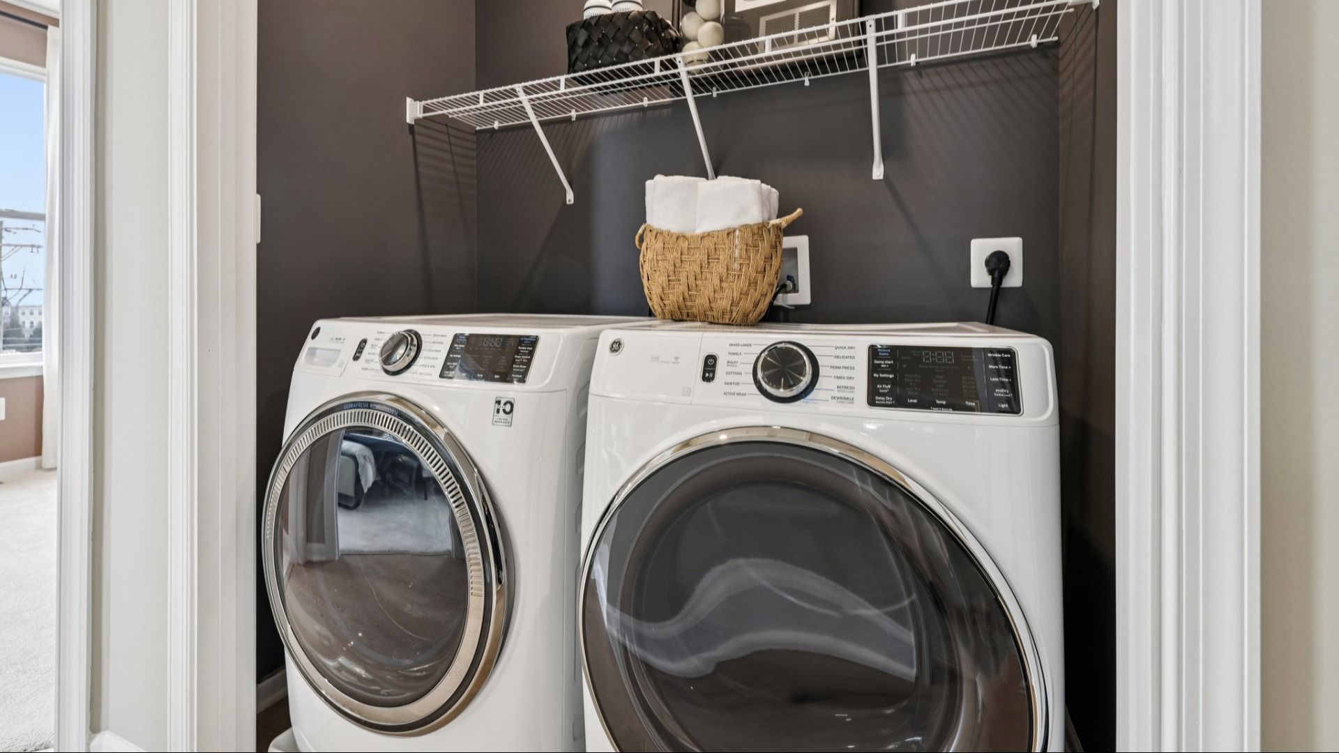 Upper-level laundry area with front-loading washer and dryer