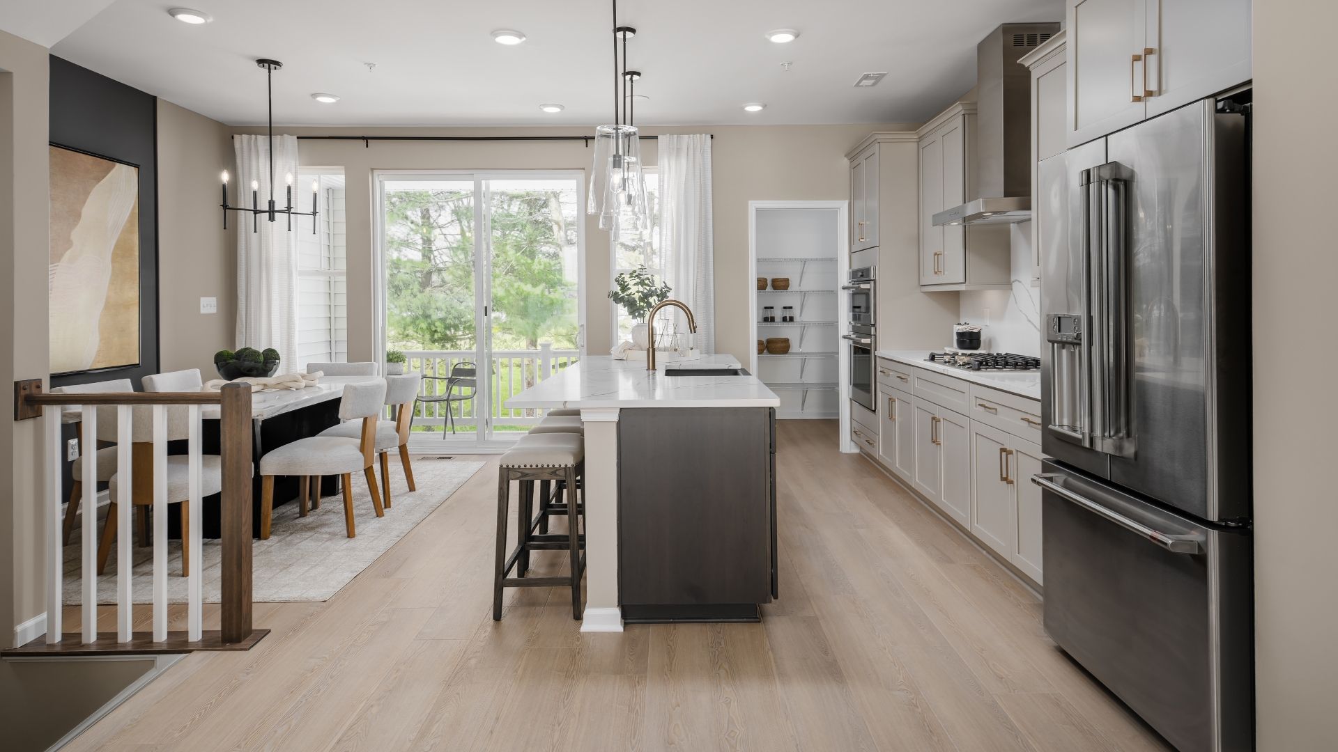 Designer finishes appoint The Bradford kitchen, featuring a striking black farmhouse sink as its bold focal point.