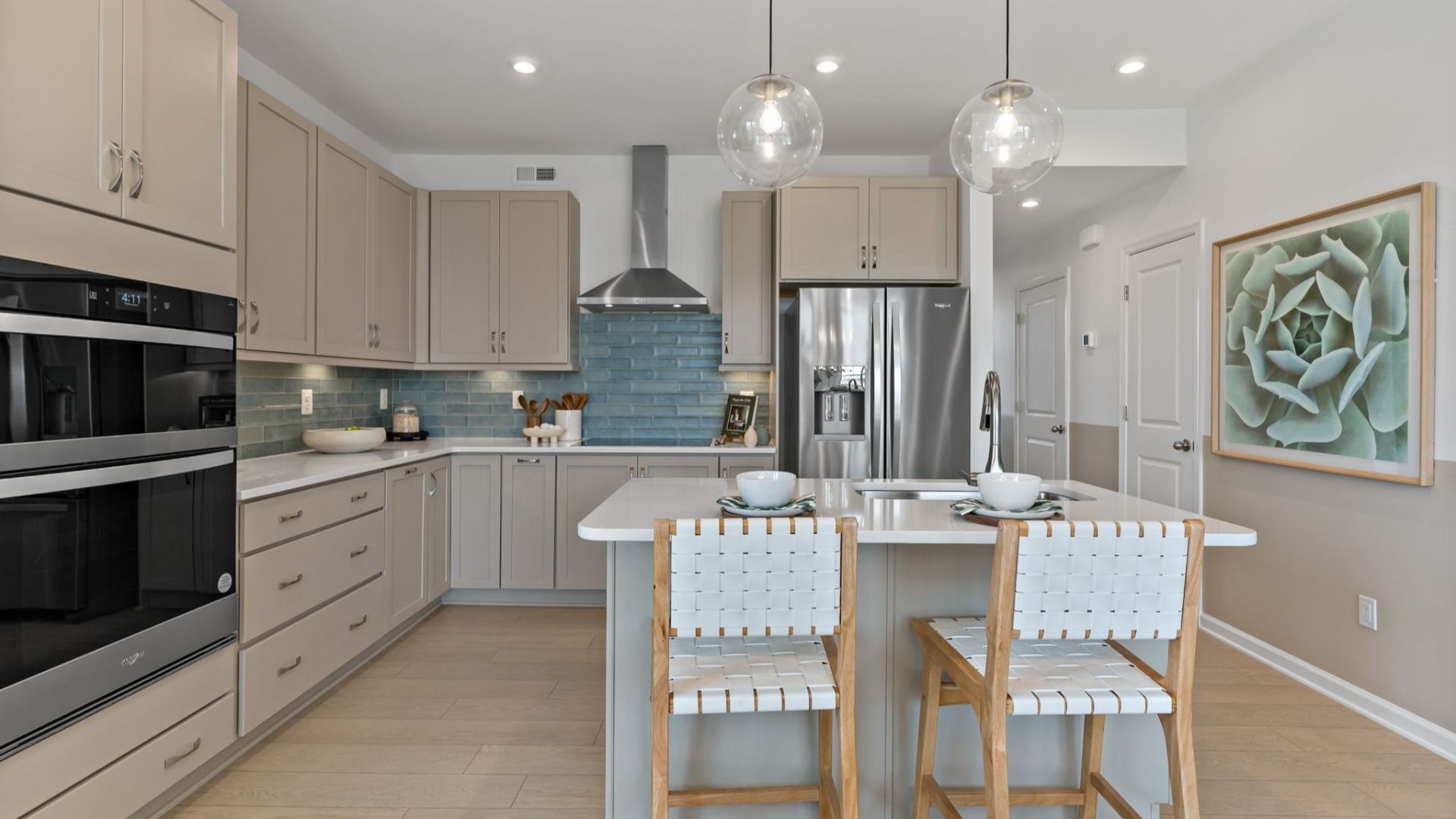 Kitchen featuring stainless steel appliances, a center island, and pendant lighting.