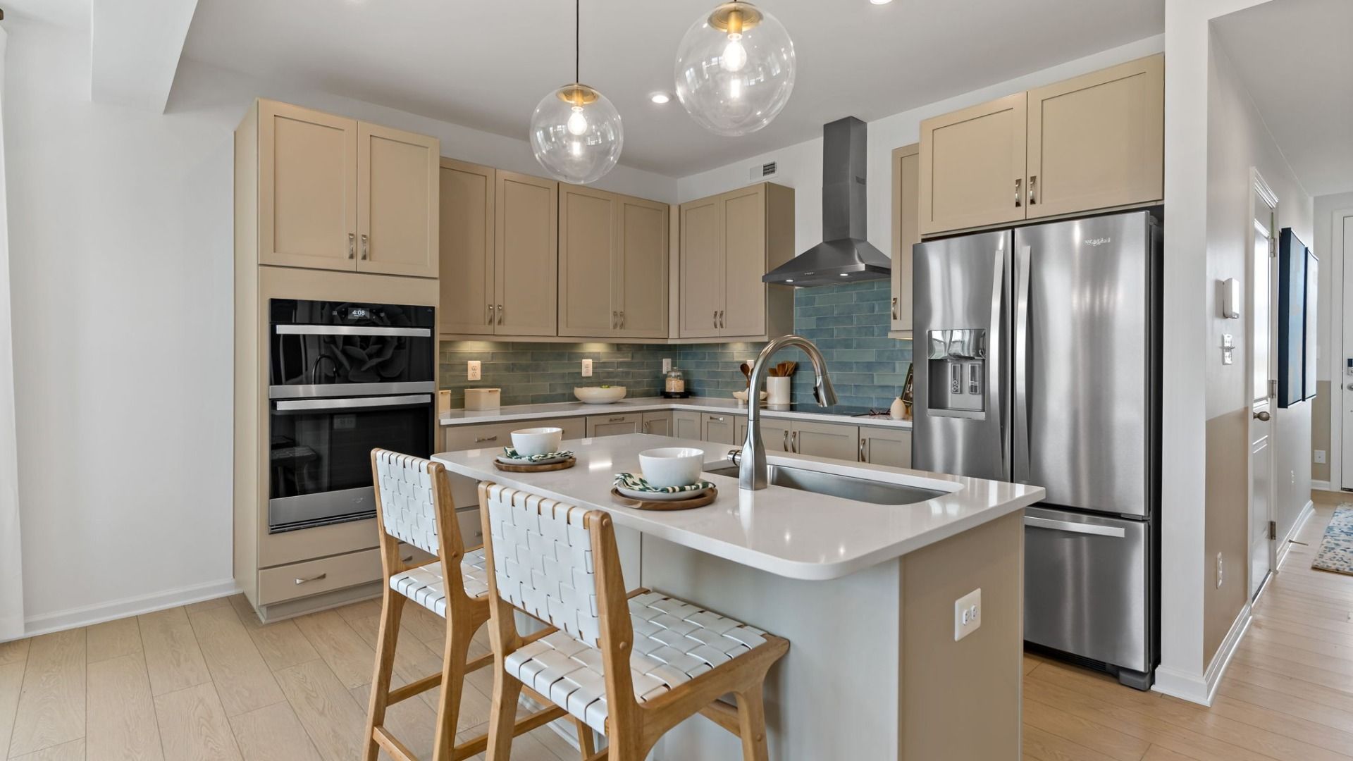 Alternate view of the kitchen, featuring a double oven and upgraded kitchen features.