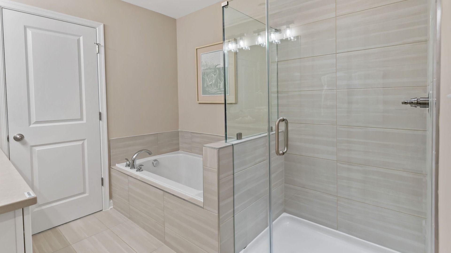 The owner's bath features a large tub and shower.