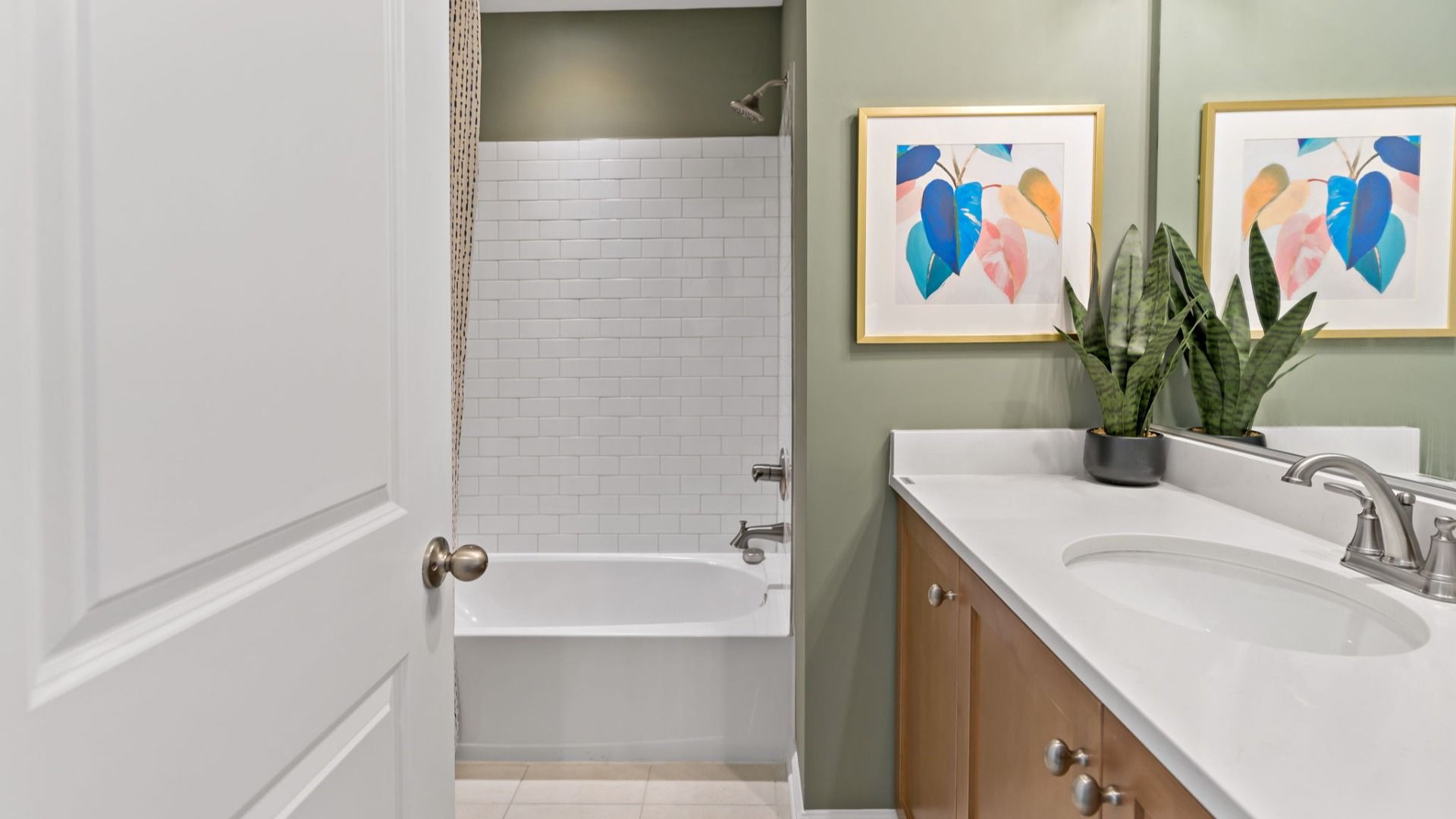 Hall bath of the Lynnhaven with vanity and shower.