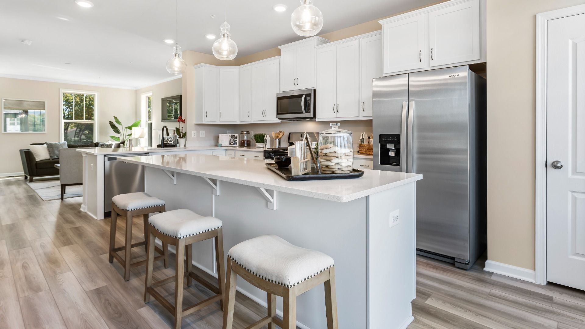 Open kitchen with large island at a DRB Homes Upton II Model at the Canterbury Station Community.