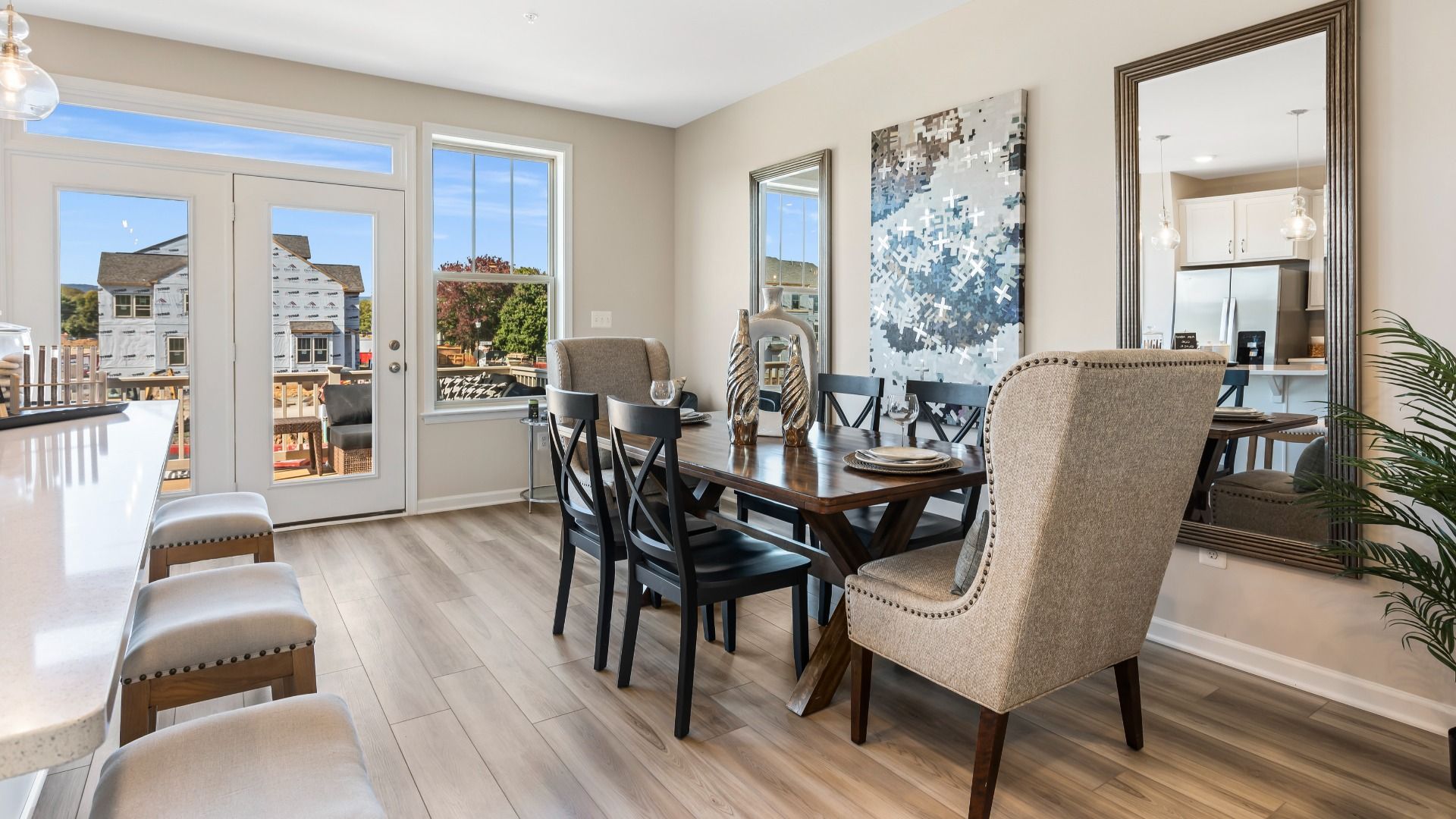 Open dining area adjacent to kitchen at a DRB Homes Upton II Model at the Canterbury Station Community.