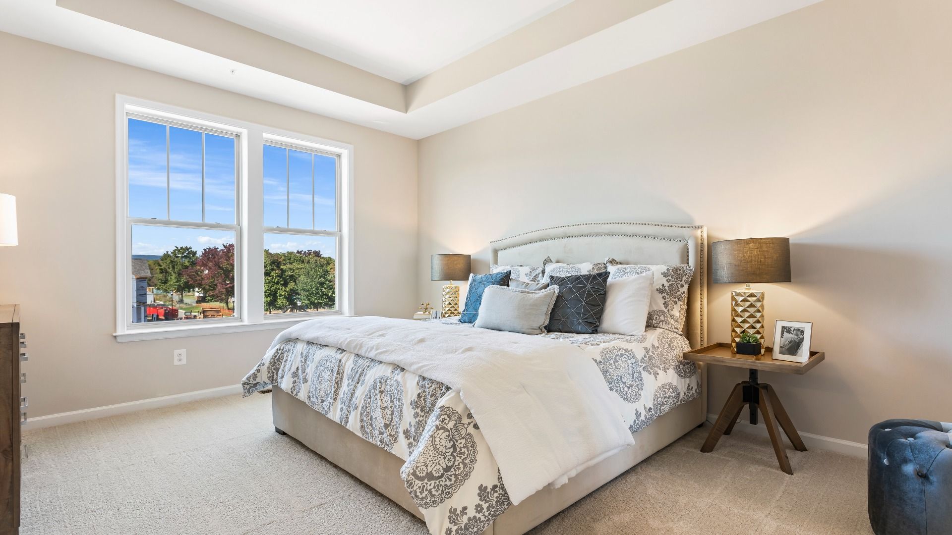 Owner's suite with tray ceiling and large double window at a DRB Homes Upton II Model at the Canterbury Station Community.