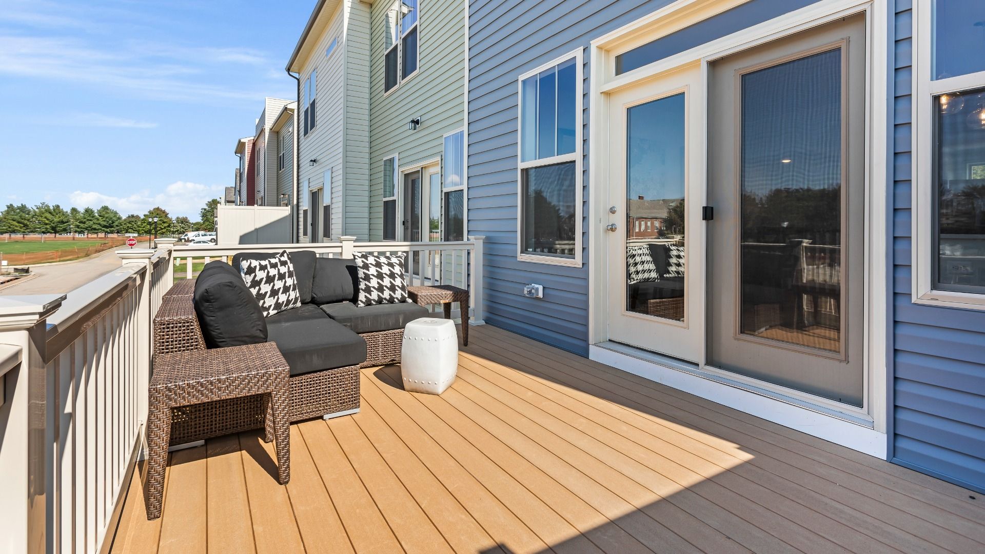Rear deck with sliding glass door to the kitchen at a DRB Homes Upton II Model at the Canterbury Station Community.