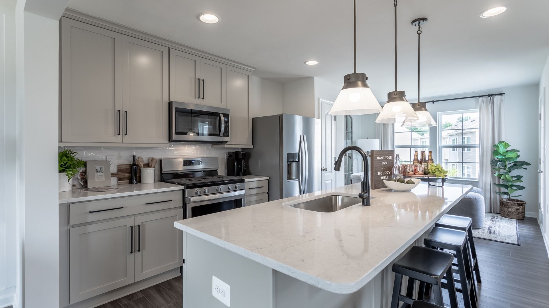 The kitchen in the York II offers a large center island with seating, combining style and function.