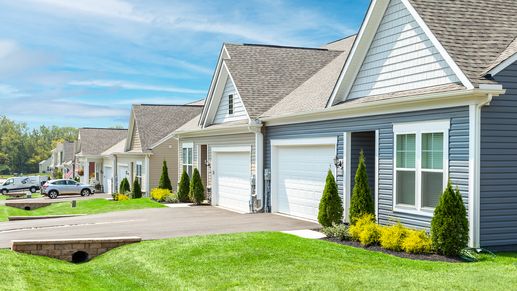 A side view showcasing multiple home exteriors, highlighting the community’s design and layout.