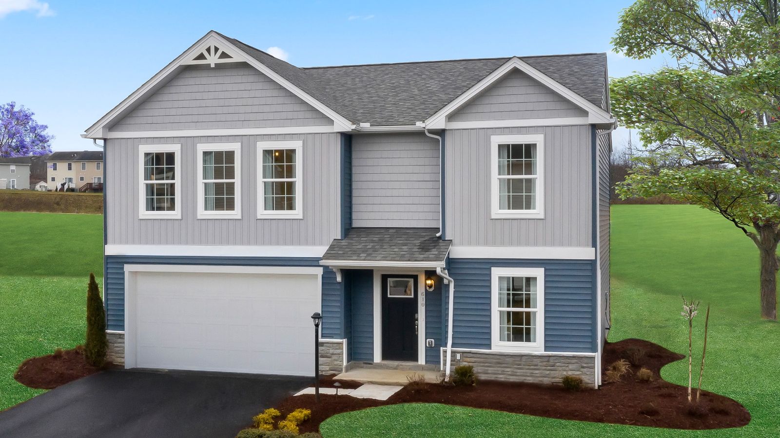 Carnegie II exterior showcasing elegant blue-gray siding and a convenient attached garage.