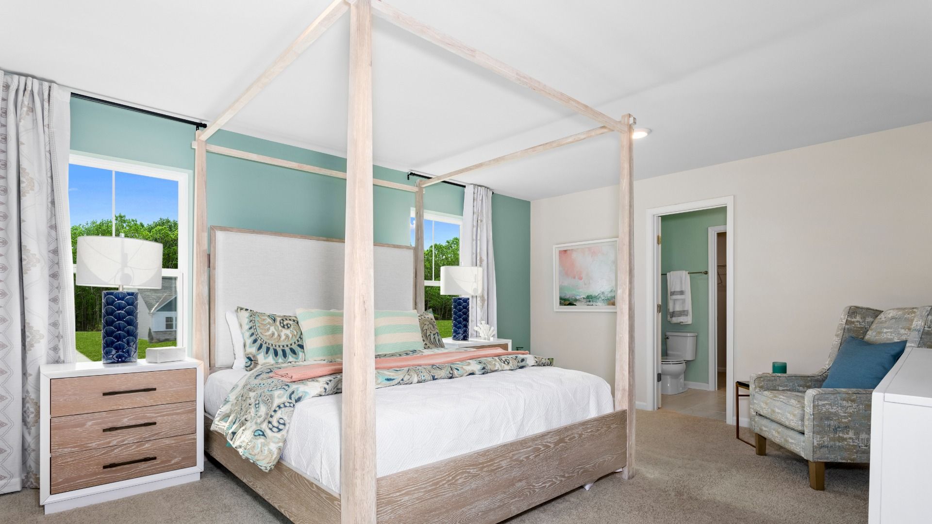 The Owner's Suite with a Four Poster Bed in the a DRB Homes Whitehall II Model Home