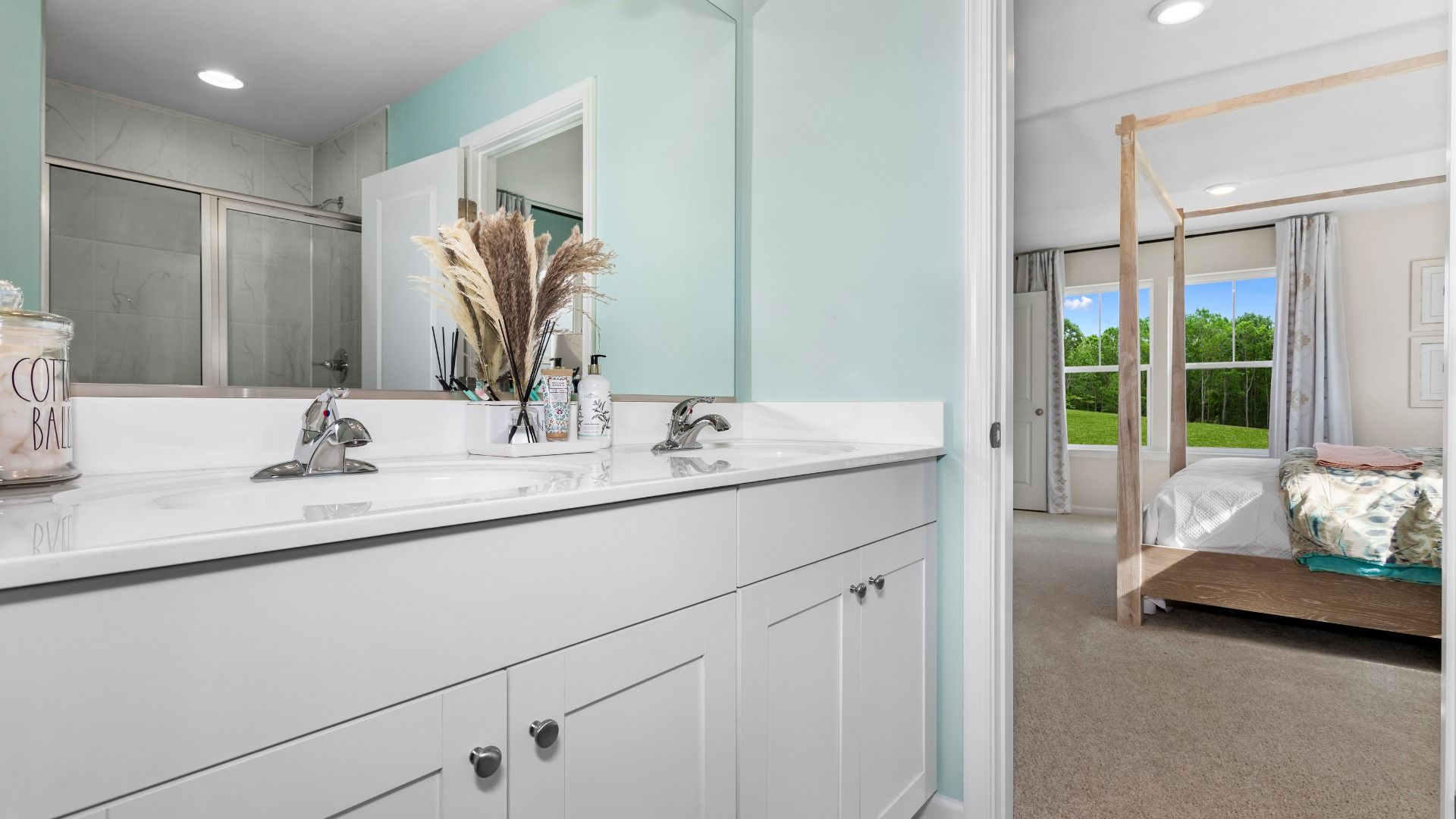 The Owner's Bath with a Dual Sink Vanity in a DRB Homes Whitehall II Model Home