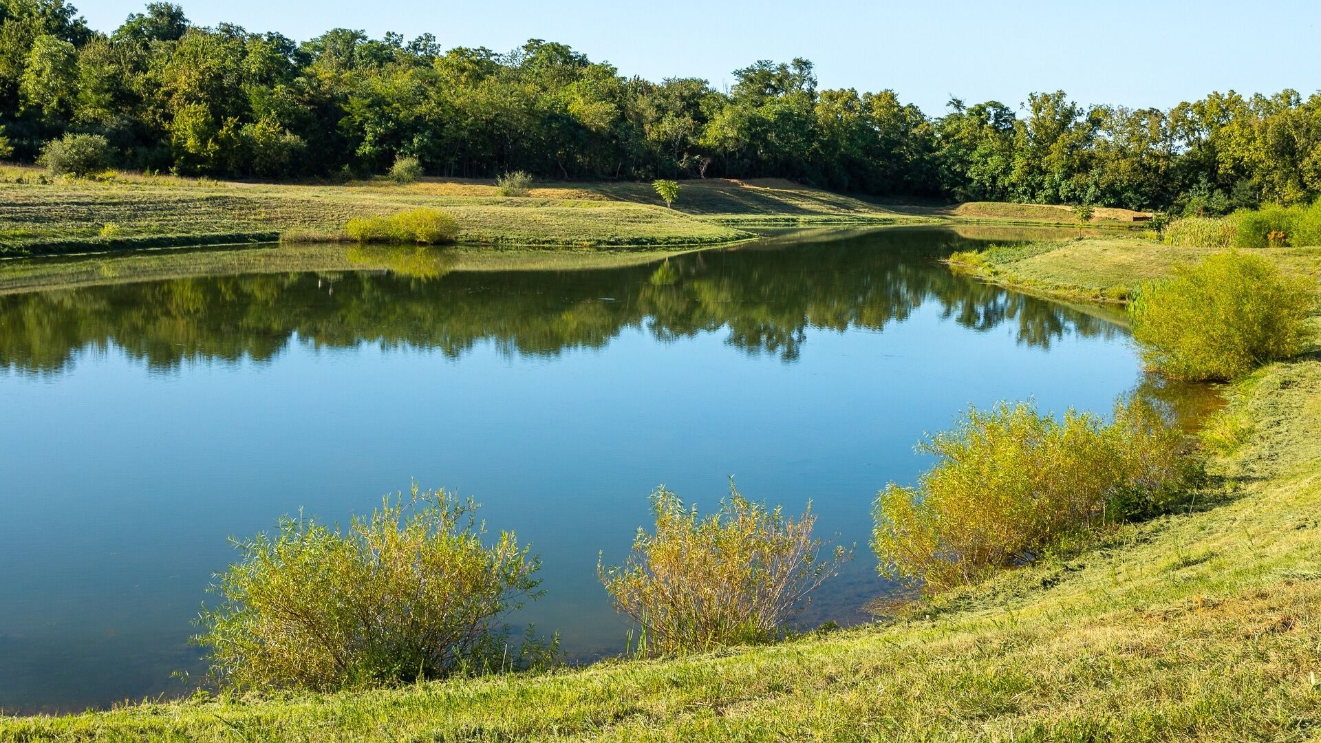 The community pond offers scenic views and a peaceful gathering spot for residents.