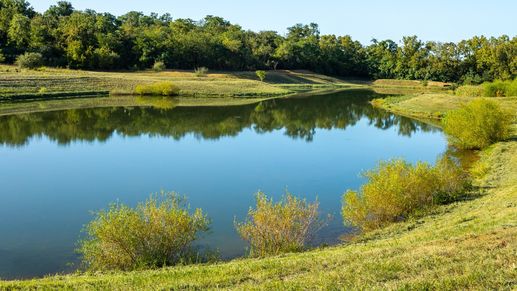 The community pond offers scenic views and a peaceful gathering spot for residents.