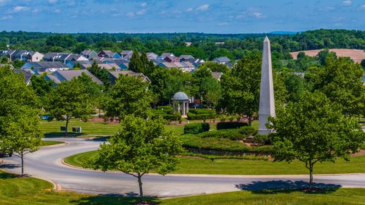 The Huntfield community entrance features welcoming monuments and open spaces.