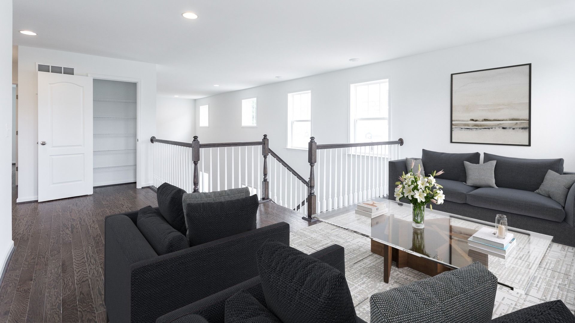 Spacious second floor loft with extra storage and modern accents in Raymore floor plan.