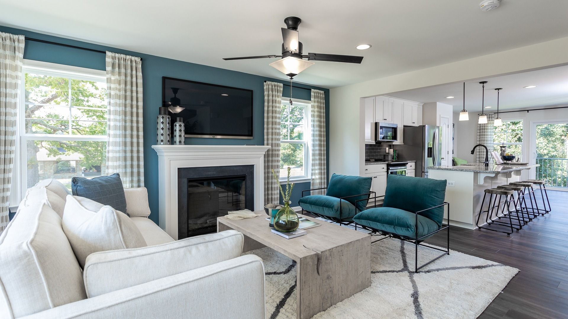 The living room in the York II floor plan features comfortable seating and a cozy fireplace.