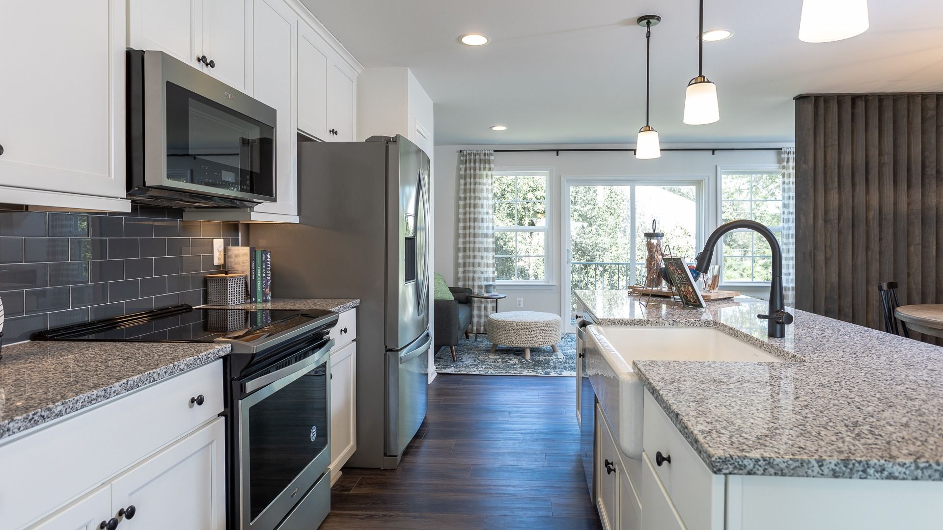 The kitchen opens into the sunroom in the York II floor plan, creating a bright, connected space.