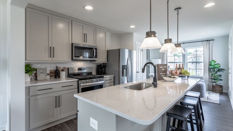 The kitchen in the York II floor plan features a large center island with a convenient prep sink