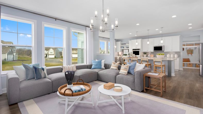 Unwind in the open-concept living room in the Bridgeport II, with ample space and bright views.
