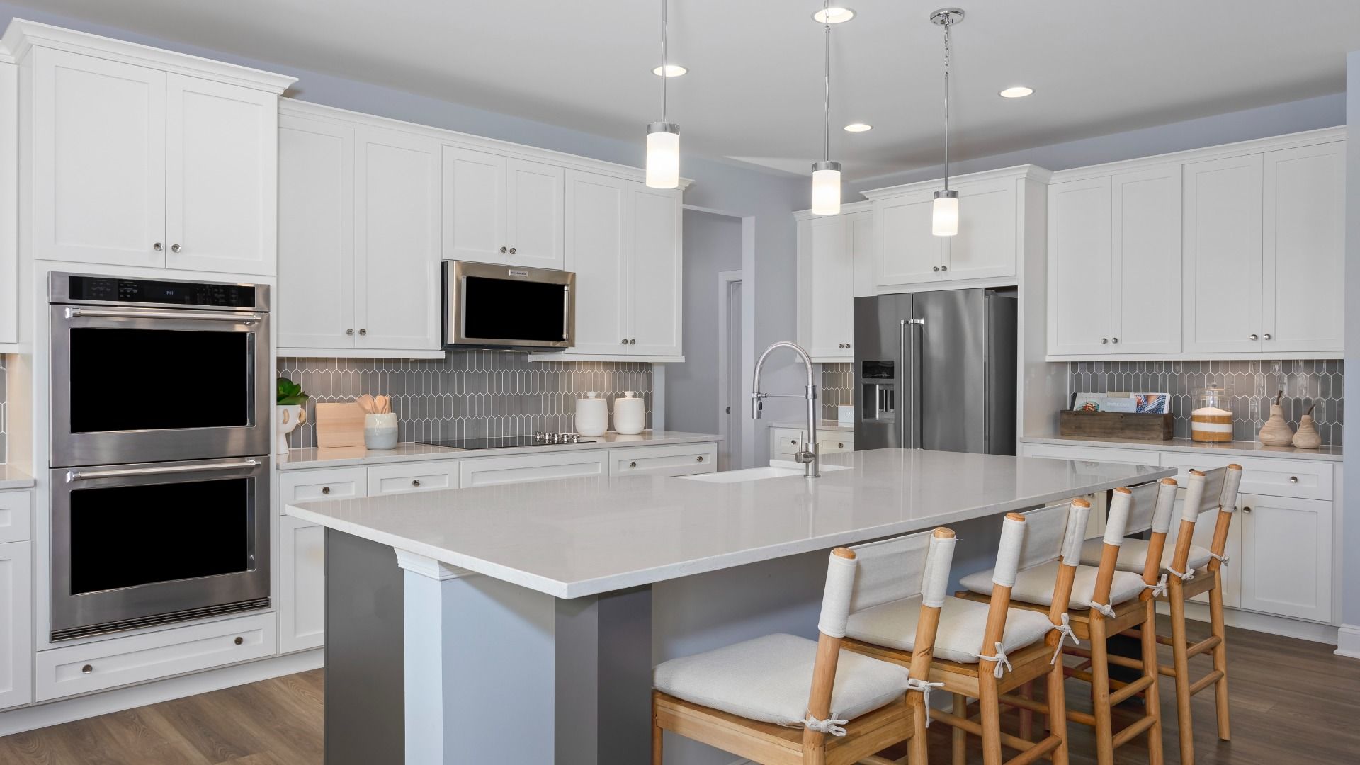 The Bridgeport II kitchen with a large island and Whirlpool appliances, bright and functional.