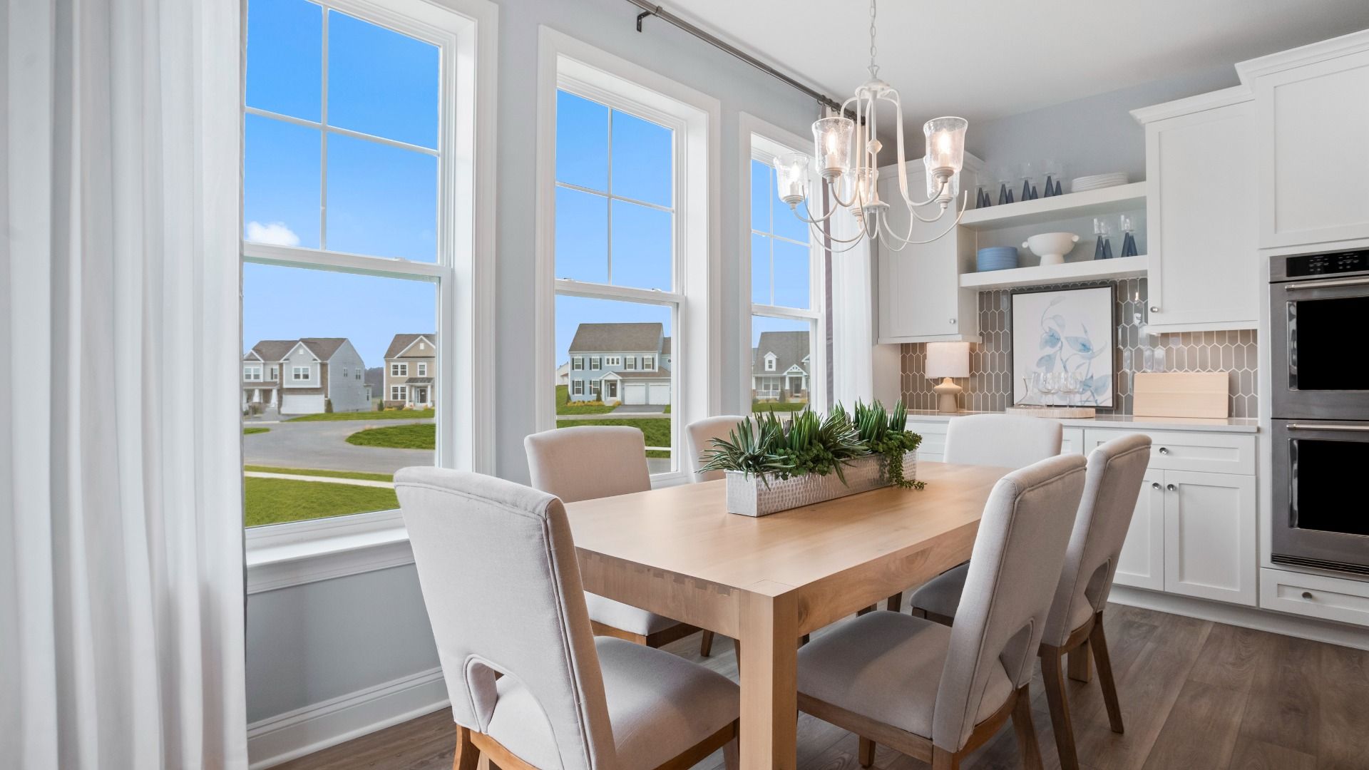 Dine while enjoying the view from large windows in the Bridgeport II floor plan.