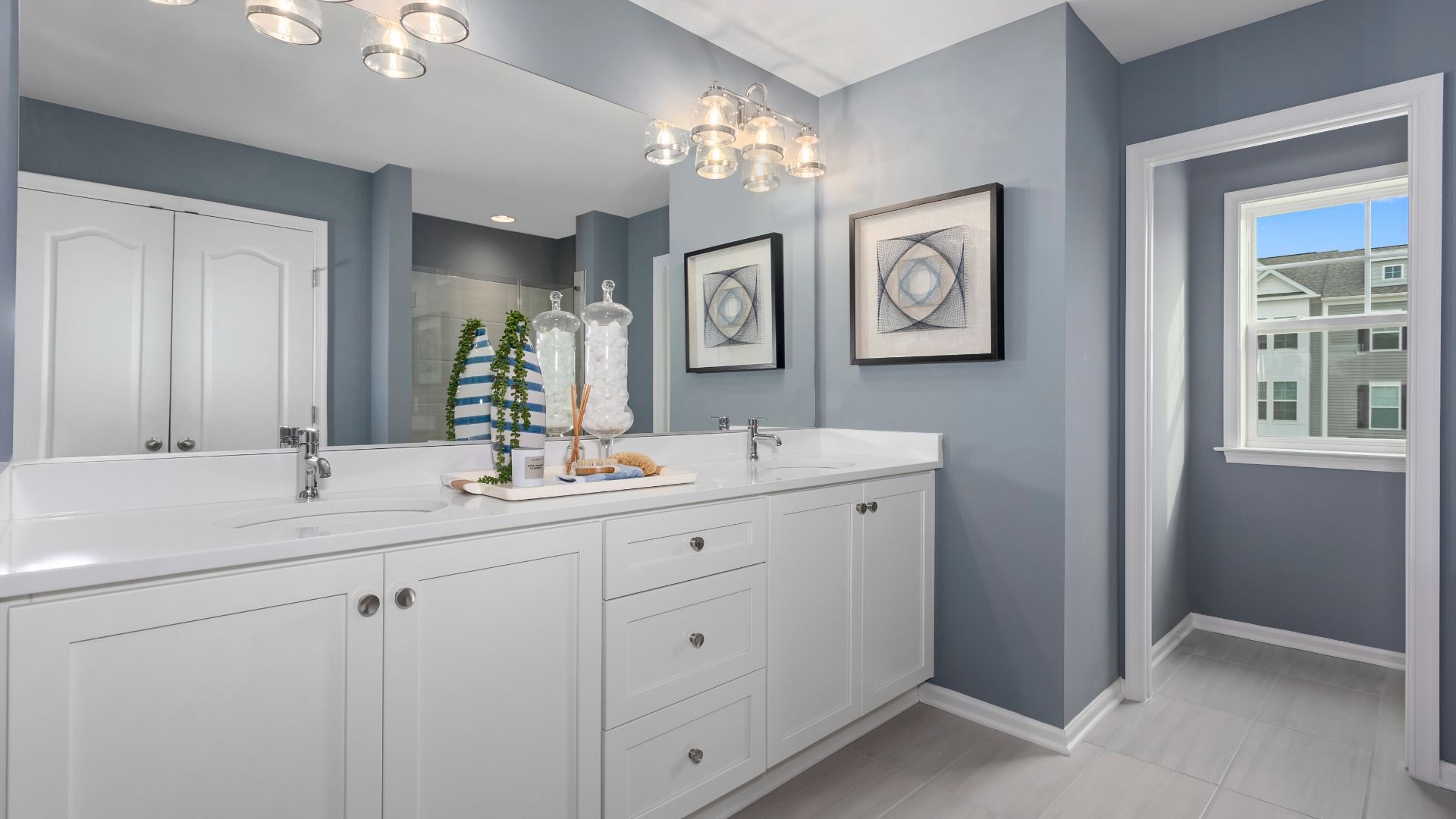 Spacious owner’s bath with dual sinks, offering an elegant and functional space in the Bridgeport II.