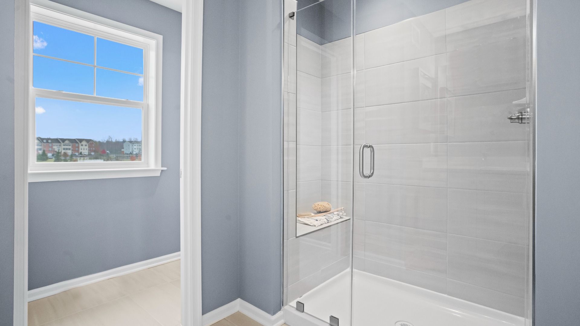 The owner’s bath in the Bridgeport II features a glass-door shower for a refined look