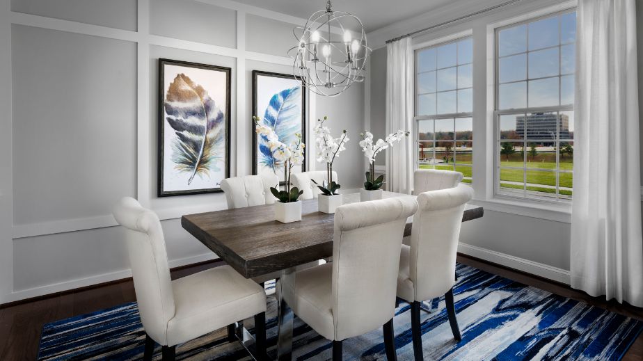 Dining room with large double window in a DRB Homes Newbury II home plan at Huntfield.