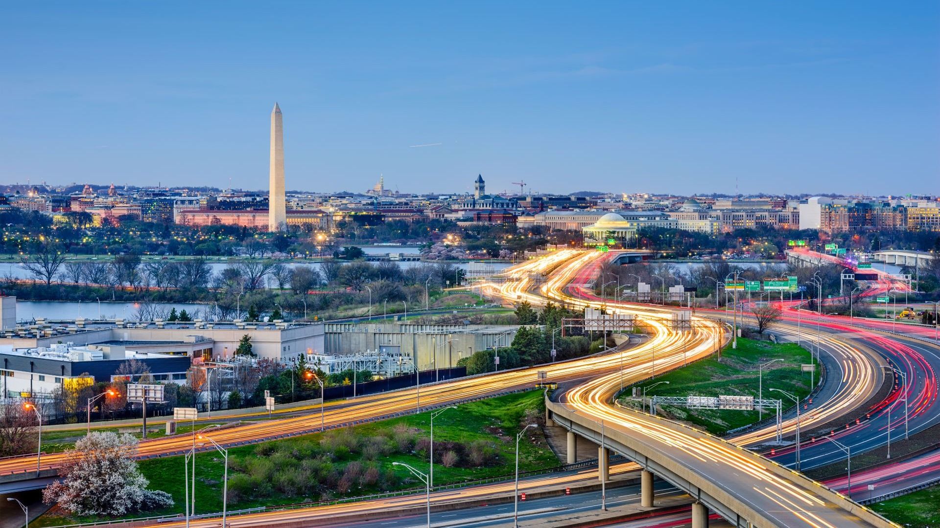Aerial view of the Washington DC skyline featuring commuter routes and the Washington monument