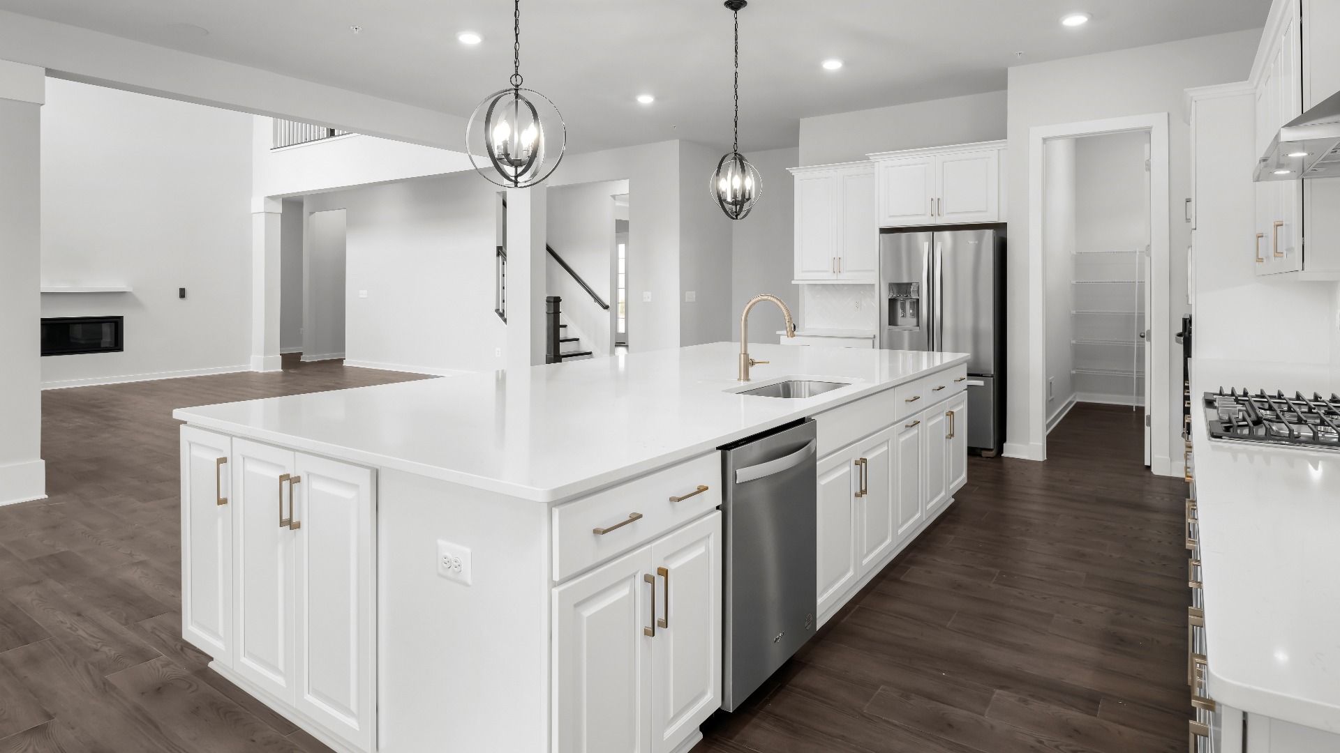 The Open-Concept Kitchen Flows Seamlessly into the Family Room in the Creighton at South Lake