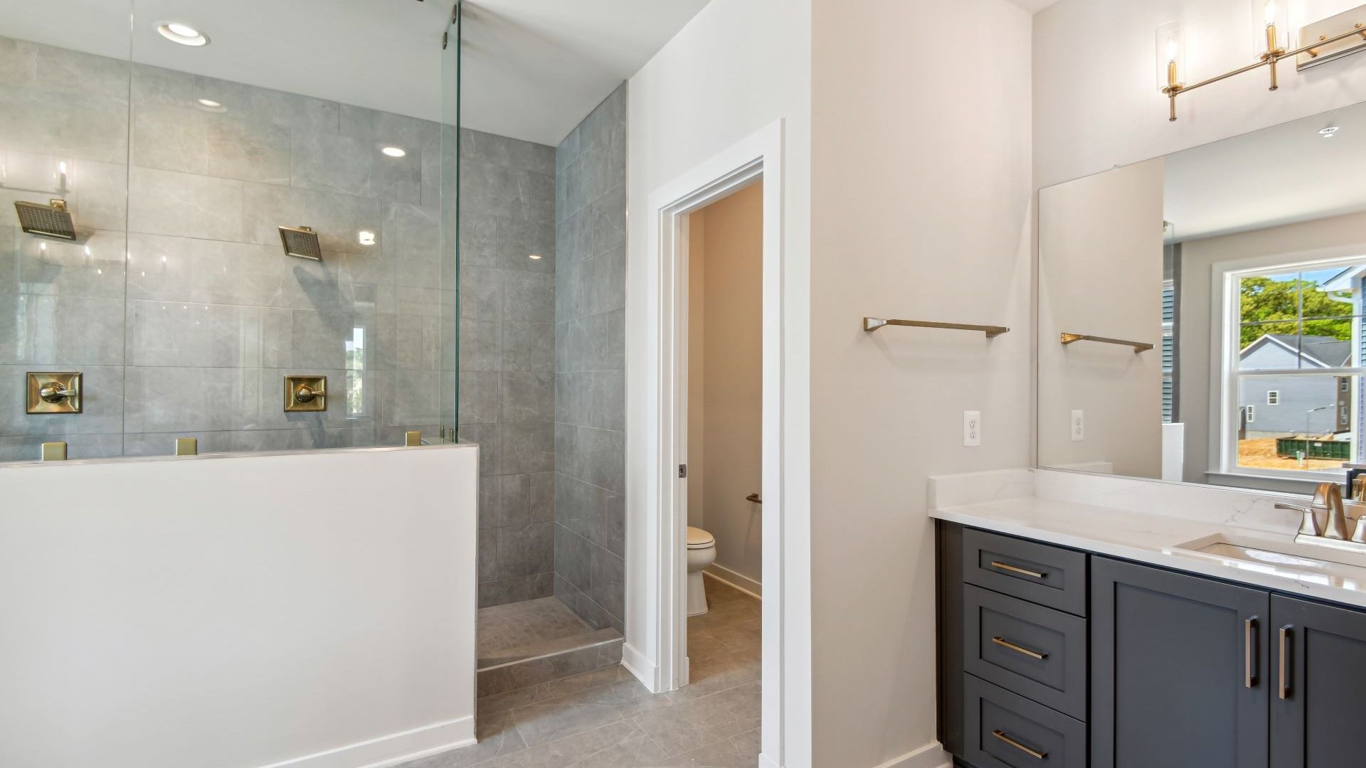 Enjoy a Luxury, Spa-Inspired Owner's Suite Bathroom with a Walk-In Shower in the Creighton at South Lake