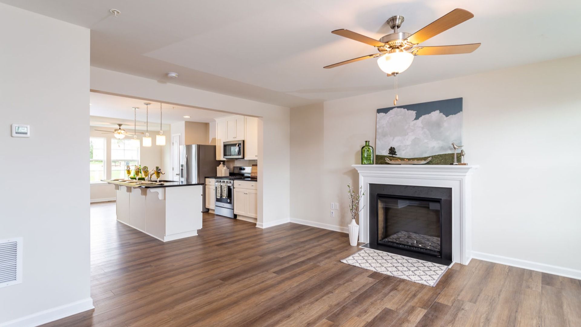 Spacious living room in a York II South Brook Townhome by DRB Homes, featuring modern decor and open floor plan in Inwood, WV