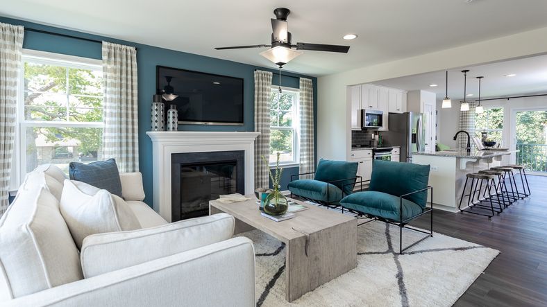 The family room in the York II floor plan features seating and a media center for cozy living.