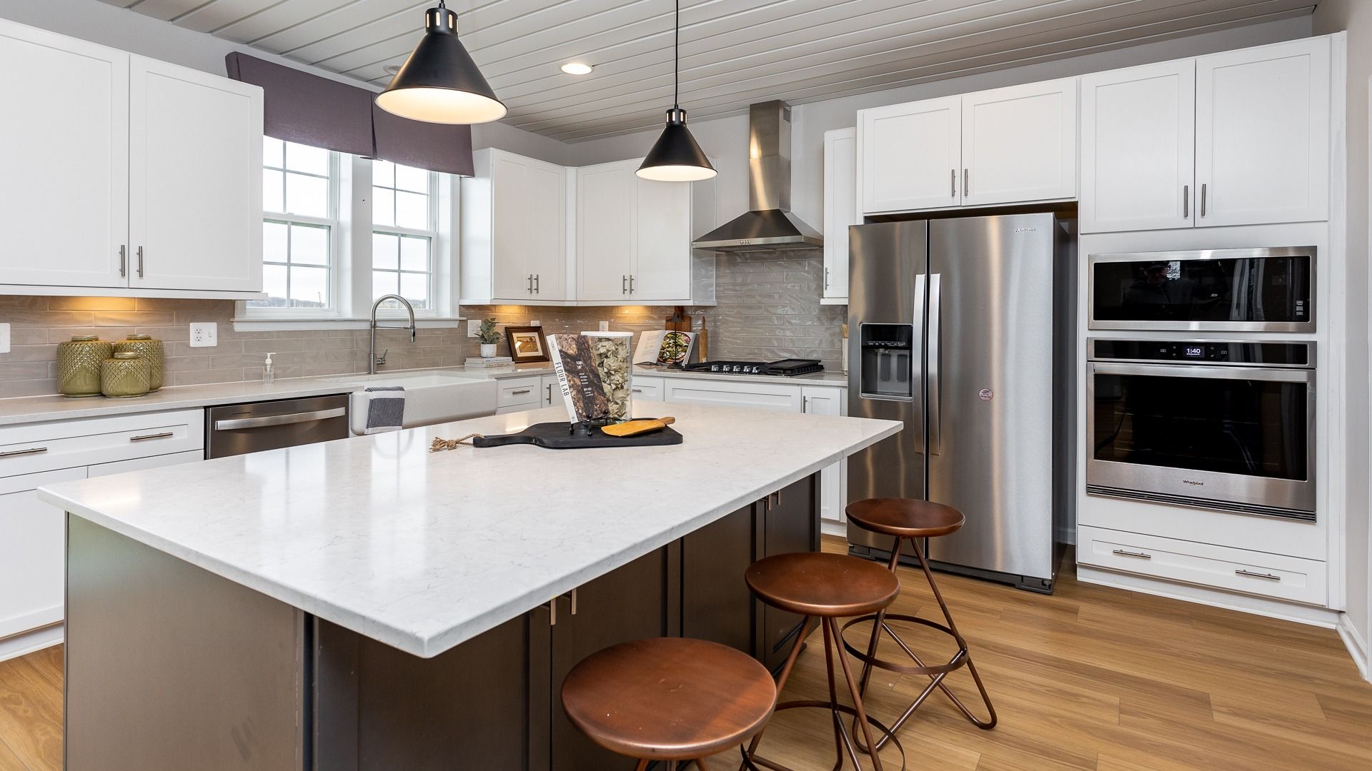 Featuring a large center island with seating, the Regent II kitchen is perfect for cooking and gathering.