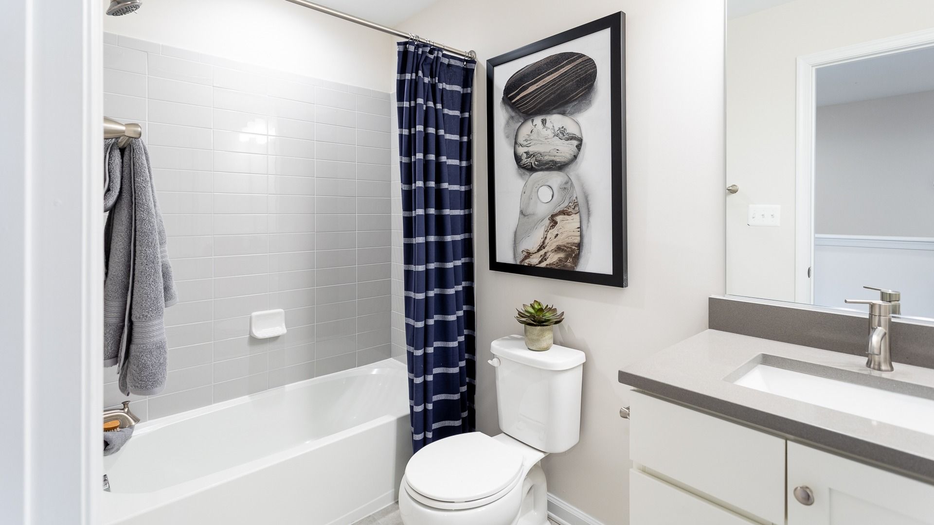In the Regent II floor plan, the hall bath features a standing tub and sink vanity.