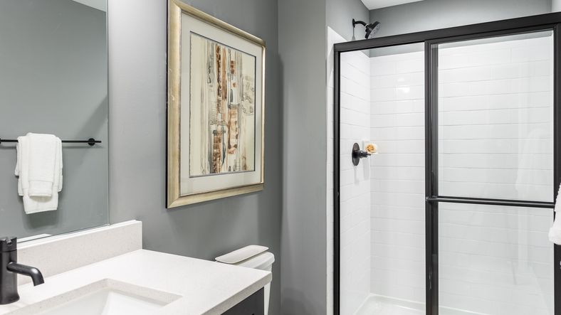 The lower level bath in the Regent II floor plan features a shower and sink vanity.
