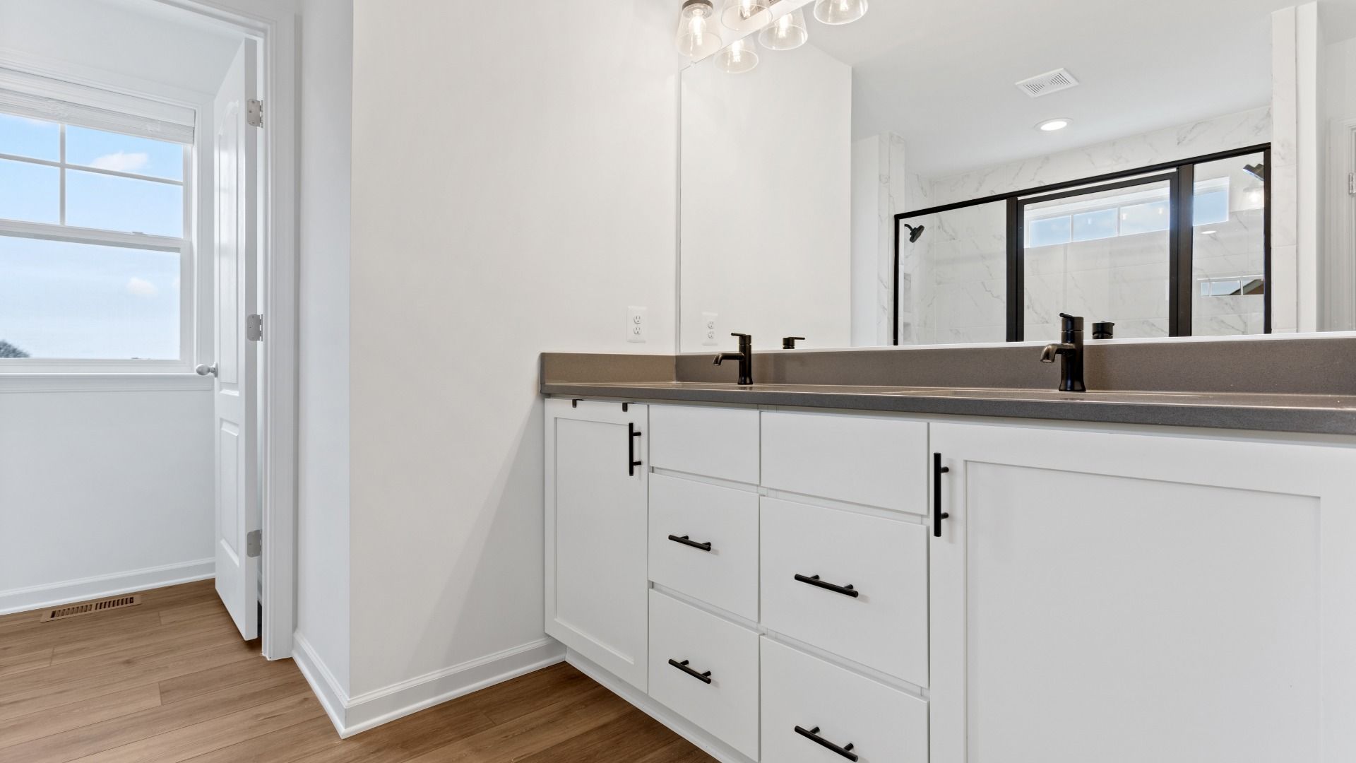 Owner's bath with dual sink vanity in a DRB Homes Bridgeport home plan at Huntfield in Charles Town, WV