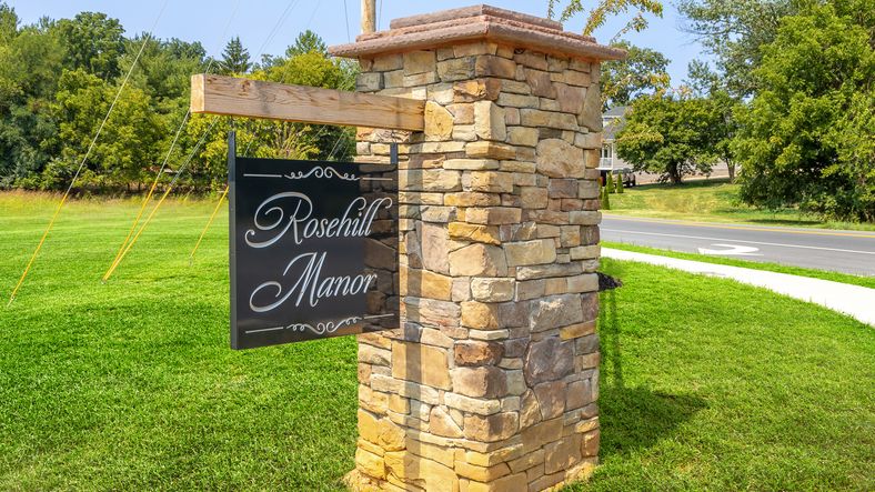 Entrance monument welcoming residents to the 55+ community, creating a stylish first impression.