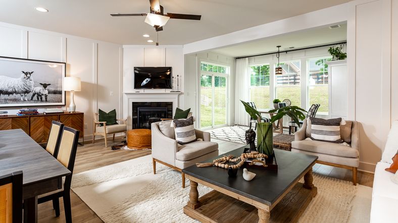 The family room in the Finch features a cozy fireplace, creating a warm and inviting atmosphere.
