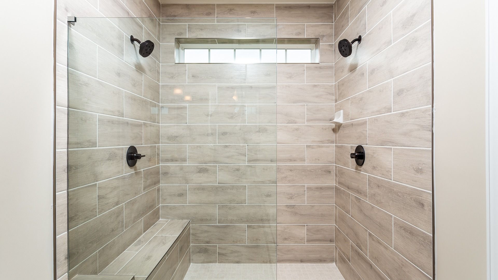 The Owner's Bath Roman Shower in the DRB Homes Finch Model at Rosehill Manor