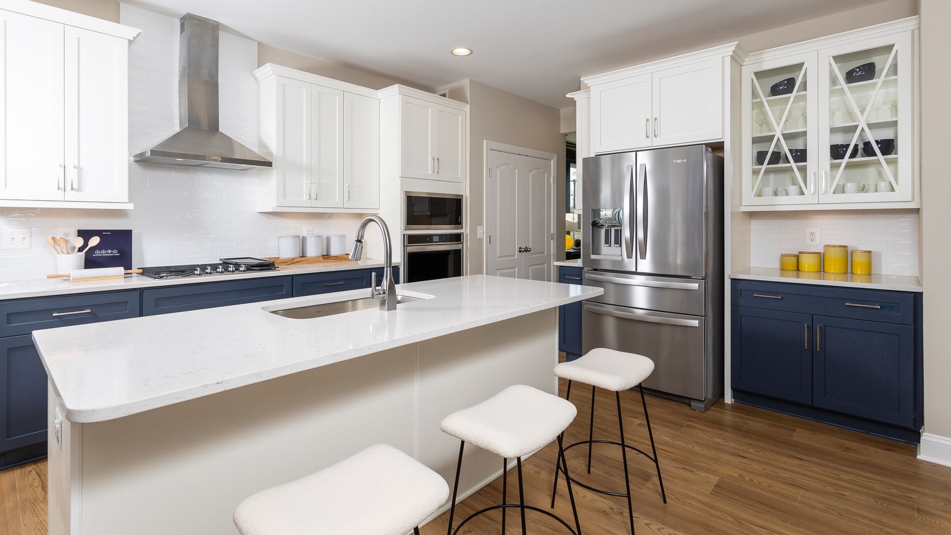 Bright kitchen with larger center island and seating in Clemson II floor plan.