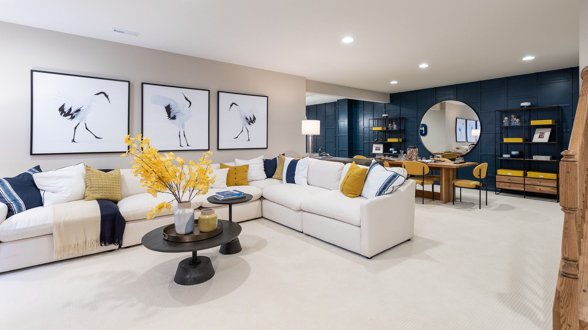 Modern finished lower level with comfortable seating and accent wall in Clemson II floor plan.