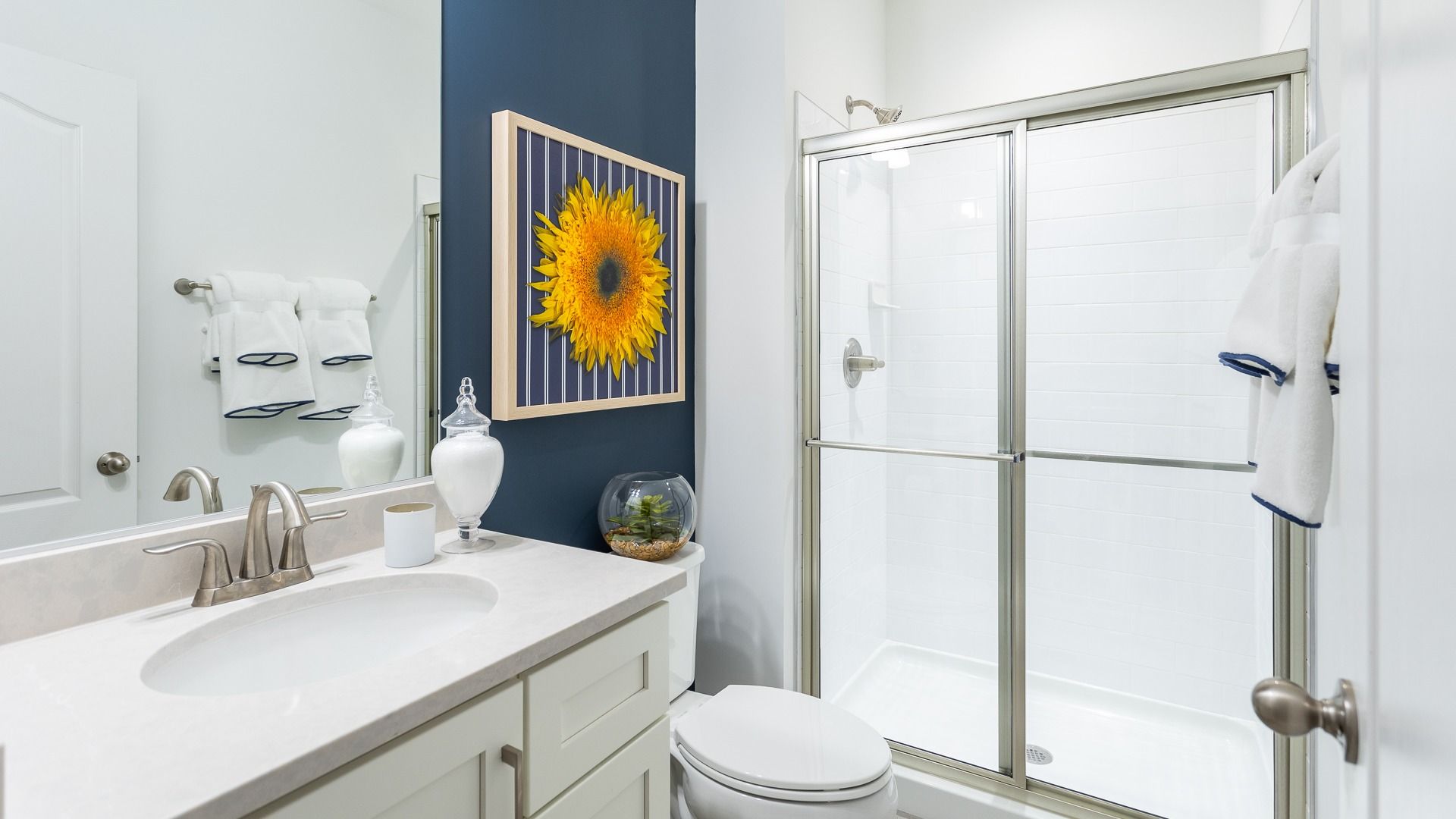 The Clemson II floor plan offers a sleek lower level full bath with a shower and single sink vanity.