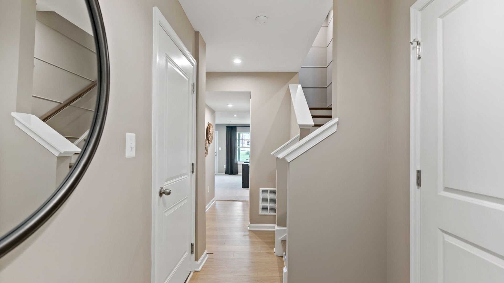 Bright and spacious hallway in a York II South Brook Townhome by DRB Homes, featuring modern design elements in Inwood, WV.