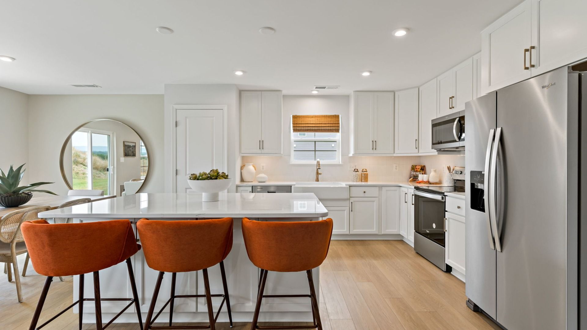 Modern kitchen with a large island in a South Brook single-level home in Inwood, WV, designed for cooking and entertaining.