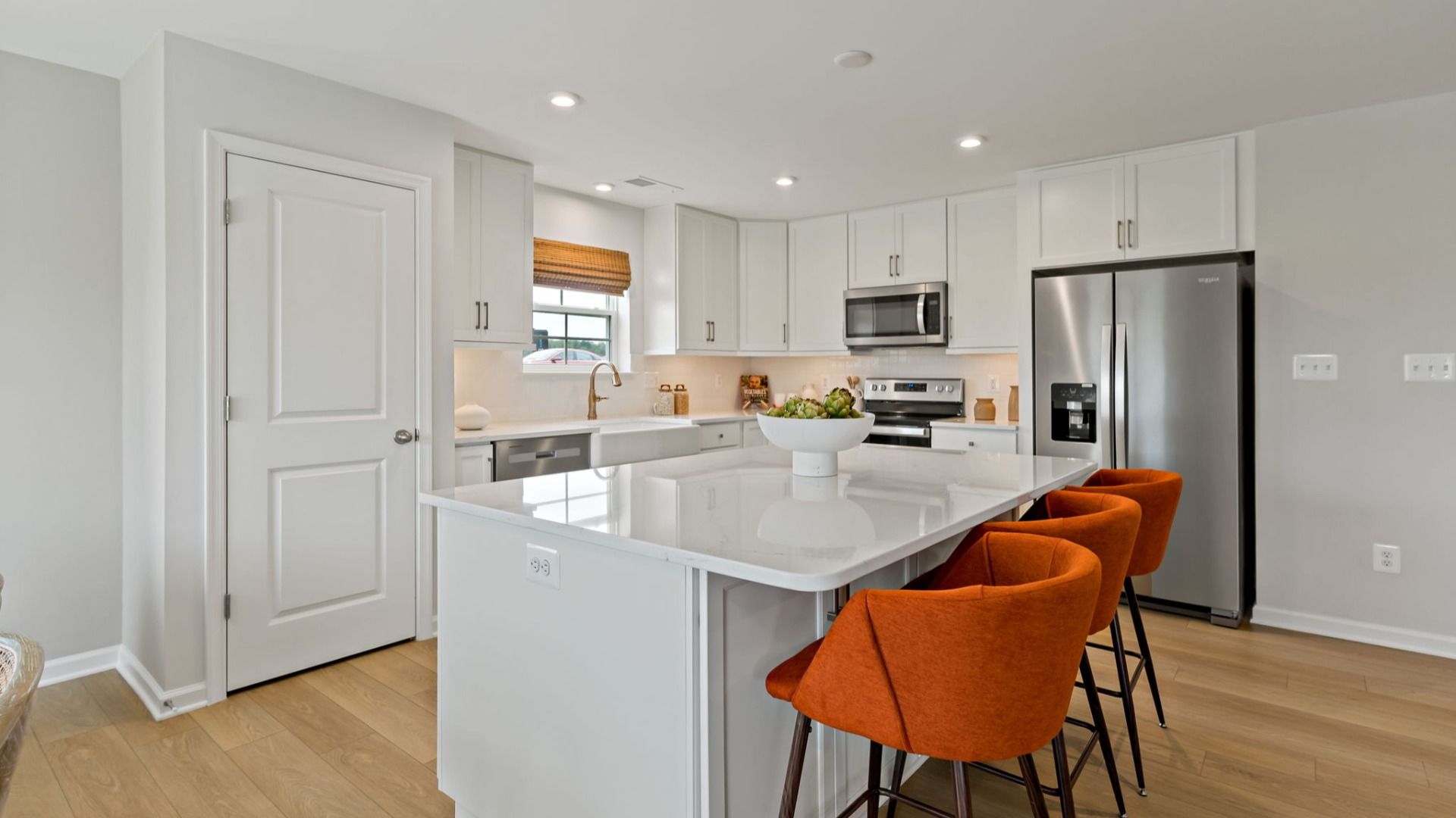 Another angle of the kitchen and island in a South Brook single-level home in Inwood, WV with modern design and functionality
