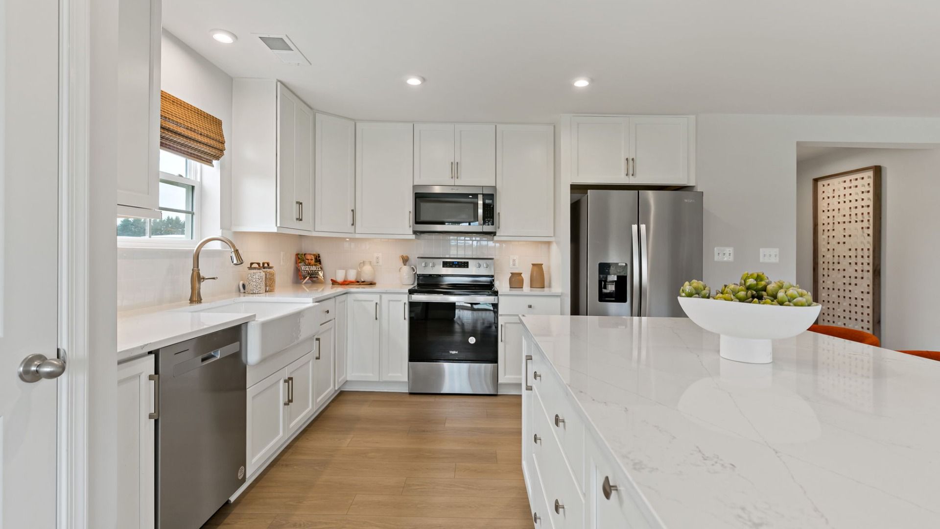 Another alternate view of the kitchen in a South Brook single-level home in Inwood, WV with modern layout and spacious design