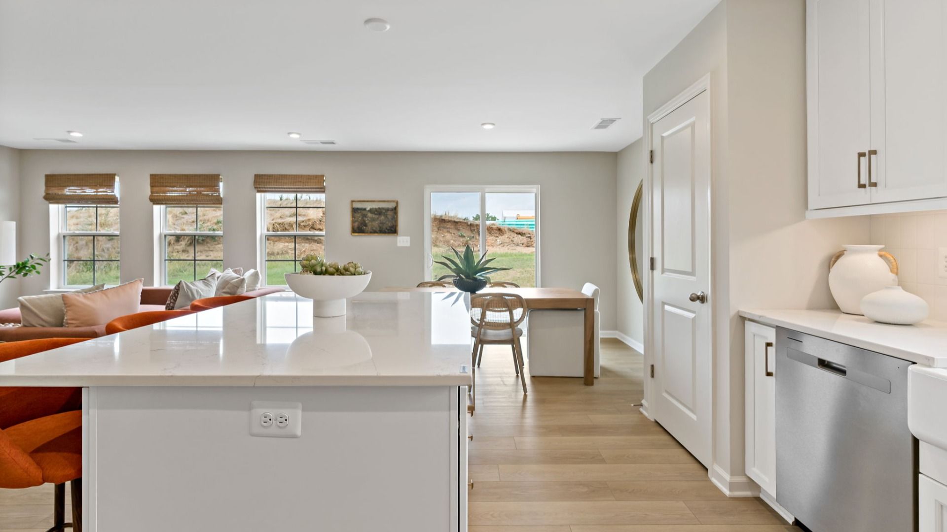 A new perspective of the kitchen and living room in South Brook Single-Level Homes, Inwood, WV. Perfect for modern living.