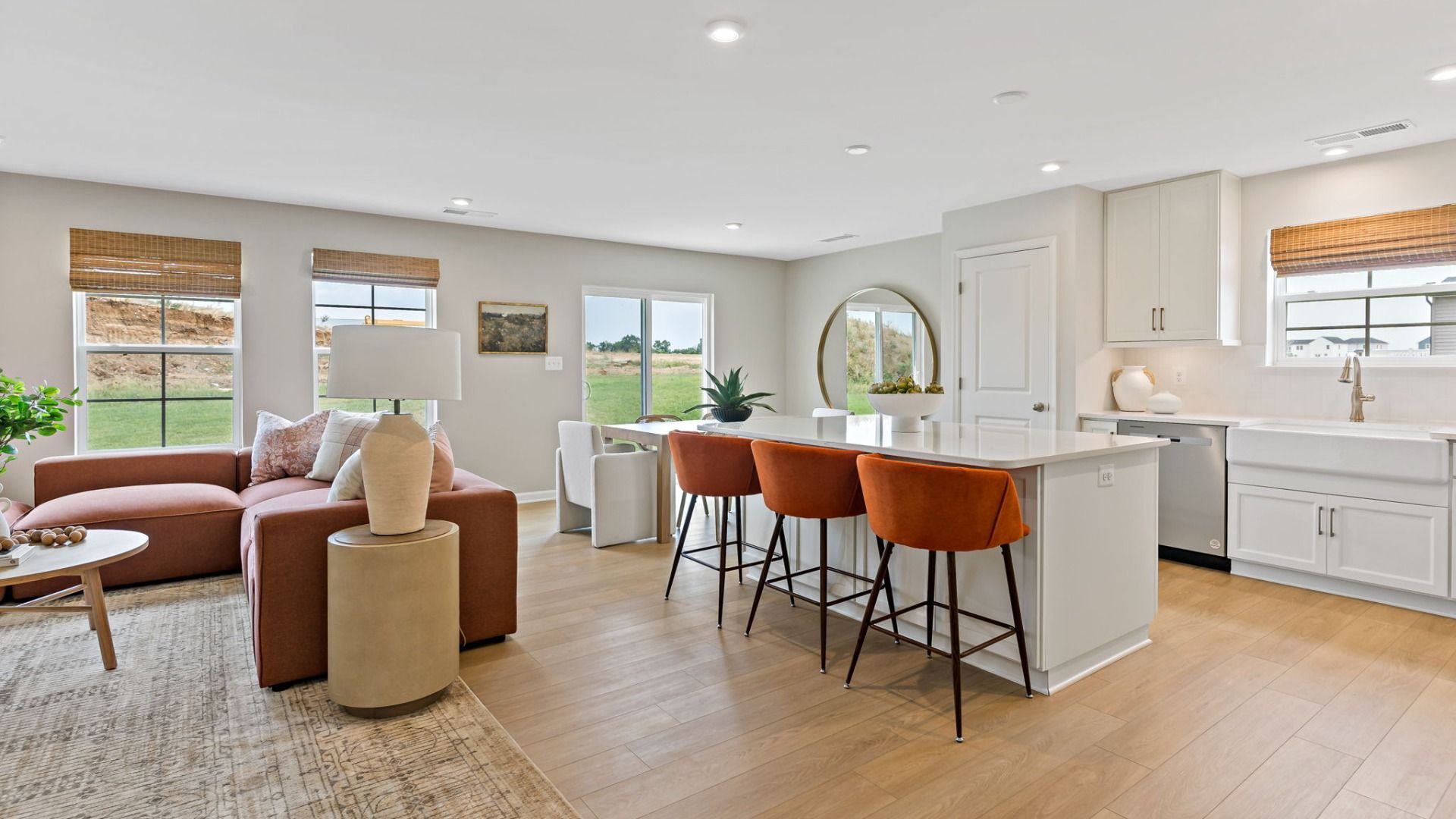 Kitchen and island with a view of the living room in a South Brook home, Inwood, WV, highlighting open concept design.
